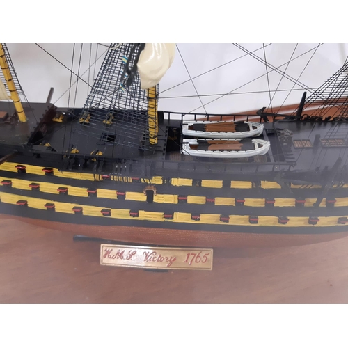 356 - Hand built model of HMS Victory 1765, finely detailed in heavy timber and perspex display case, toge... 