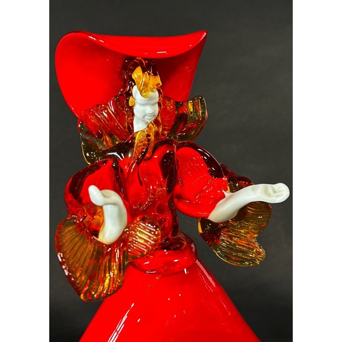 1108 - A Murano glass lady wearing a flared red A line dress with gold ruffled sleeves and flamboyant match... 