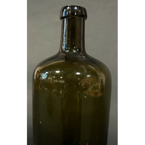 1109 - An 18th century green glass bottle, 26cm high.