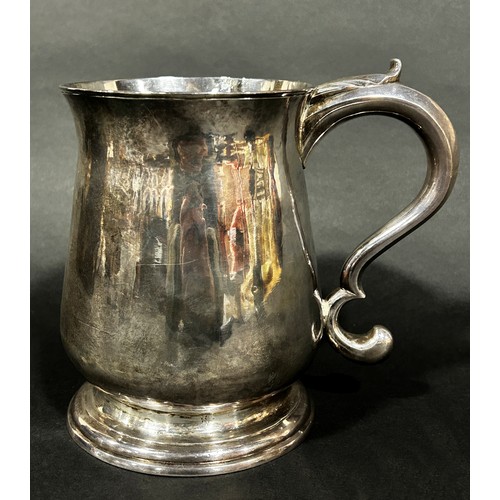 1214 - A Channel Islands silver 2 pint baluster tankard with an acanthus scrolled handle, stamped I H of Gu... 
