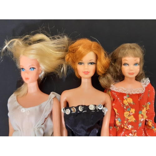 381 - Large collection of vintage dolls and dolls clothes including 3 Barbies by Mattel (all with twisting... 