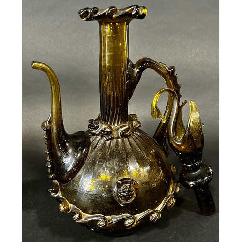 1110 - A Spanish Gardiola amber green glass decanter, with a long slender neck and swan stopper, 46cm high.