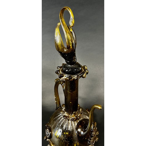 1110 - A Spanish Gardiola amber green glass decanter, with a long slender neck and swan stopper, 46cm high.