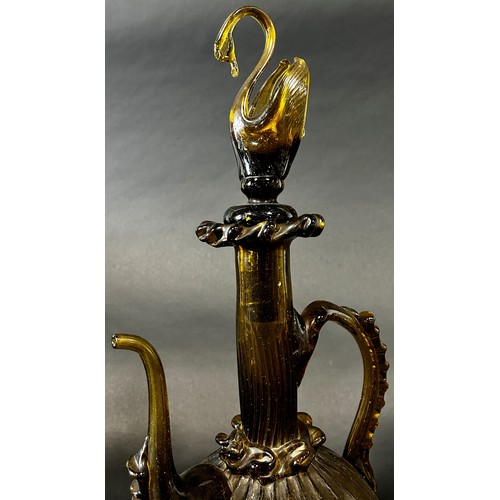 1110 - A Spanish Gardiola amber green glass decanter, with a long slender neck and swan stopper, 46cm high.