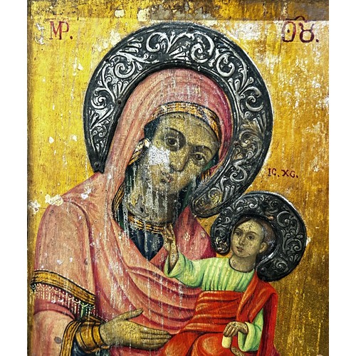 75 - 19th Century Russian icon of Madonna and Child, tempera and gilding on panel with white metal repous... 