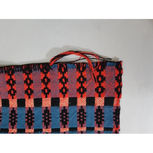 411 - Traditional woollen Welsh blanket in reversible double weave, in red, blue, black and white colours,... 