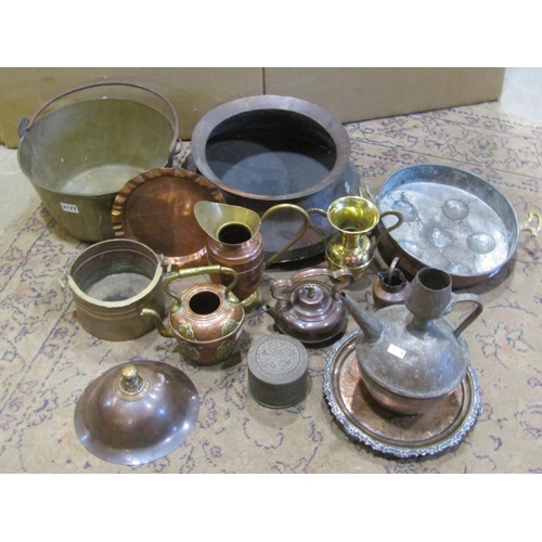 2164 - A miscellaneous collection of antique and later copper and brass items to include a jam pan, eastern... 