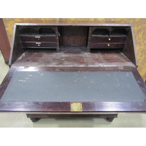 2234 - A George III pine bureau, with original stained finish, fitted with three long and two short drawers... 