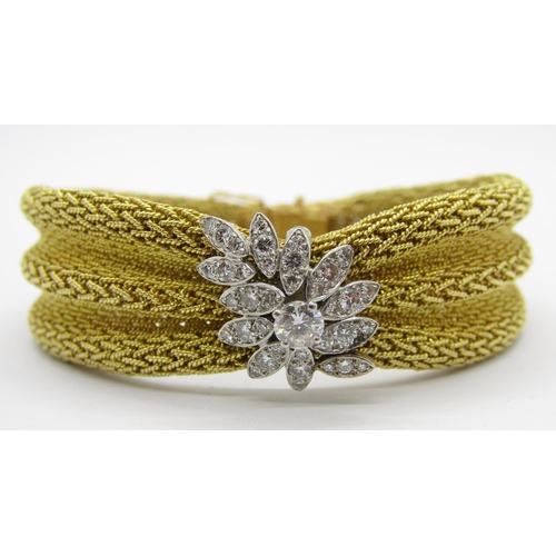 Fine Cartier vintage 18ct yellow gold ribbon bracelet set with a cluster of thirty-seven diamonds in white gold setting, the largest diamond 0.25ct approx, the clasp signed Cartier, with 1962 date stamp and model no. L6387 ?, 18.5cm L approx excluding inner clasp, 59.2g (one safety catch missing)