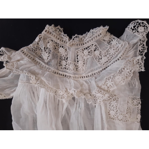 437 - A collection of early to mid 20th century textiles including 2 baby gowns both with lace inserts and... 