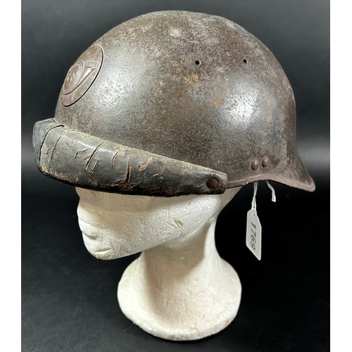 1769 - A French WWI period Trench Helmet, with applied ‘R F’ insignia.