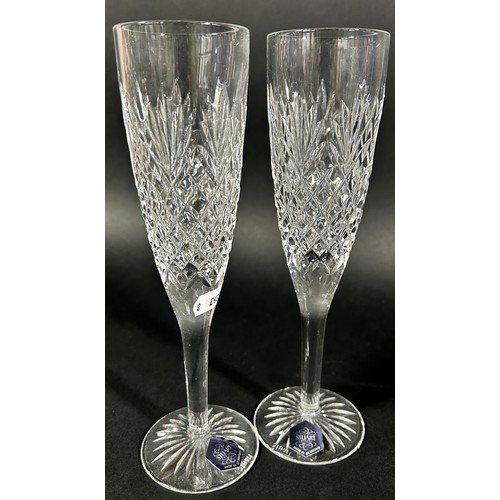 1126 - A pair of elegant long stemmed Limoncello glasses, 25.5cm tall, a pair of Stuart Champagne flutes, a... 