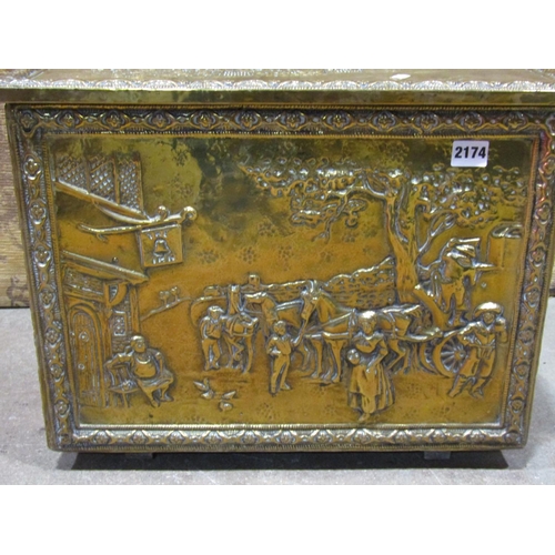 2174 - A large pressed brass coal bin with figural Tavern seen decoration together with a brass jam pan (2)