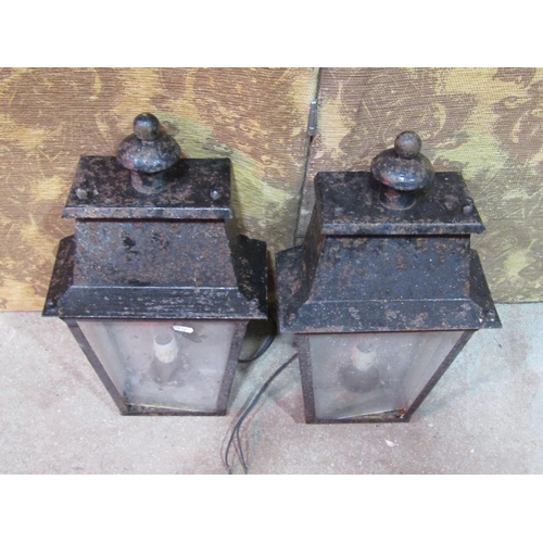 2178 - A pair of exterior wall mounted porch lanterns of tapered form with glazed panels (af)