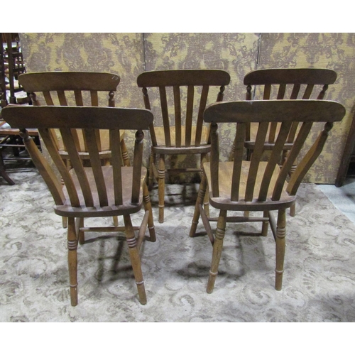 2190 - A harlequin set of elm seat lathe back kitchen chairs, with saddle shaped seats