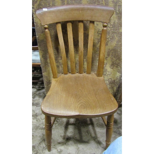 2190 - A harlequin set of elm seat lathe back kitchen chairs, with saddle shaped seats