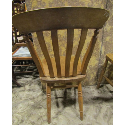 2190 - A harlequin set of elm seat lathe back kitchen chairs, with saddle shaped seats