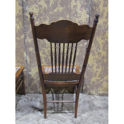 2193 - Pair of low dining/side chairs with turned bobbin spindle backs, carved detail and upholstered kelim... 