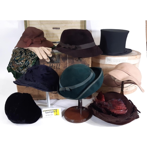 440 - A collection of vintage ladies clothing including  felt hats, a simple woven cane/ black silk sun ha... 