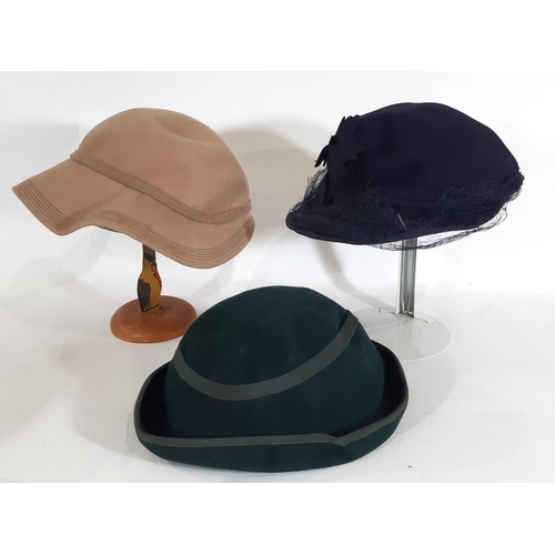 440 - A collection of vintage ladies clothing including  felt hats, a simple woven cane/ black silk sun ha... 