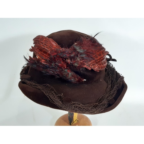 440 - A collection of vintage ladies clothing including  felt hats, a simple woven cane/ black silk sun ha... 