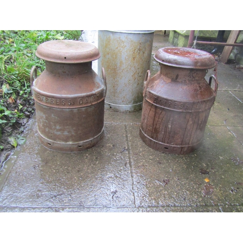 2020 - Two vintage Ex-Express dairy heavy gauge milk churns and caps, 47cm high, one other stamped Hanworth... 