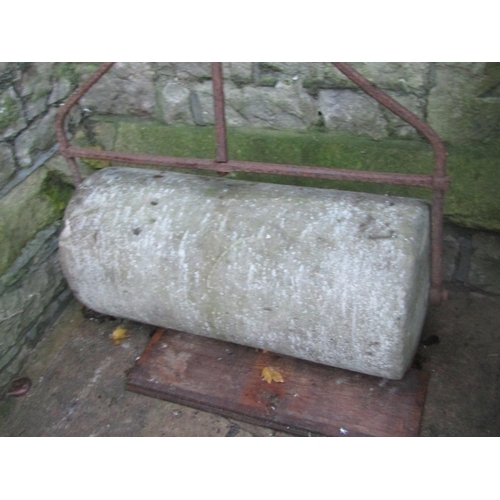 A 19th century (or possibly earlier) large stone garden roller, with  wrought iron frame and T shaped