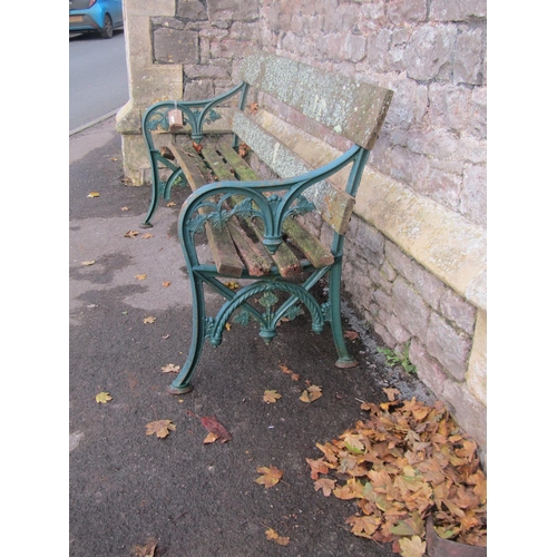 2054 - Victorian bench with weathered timber slats (af) raised on decorative vine leaf cast iron end suppor... 