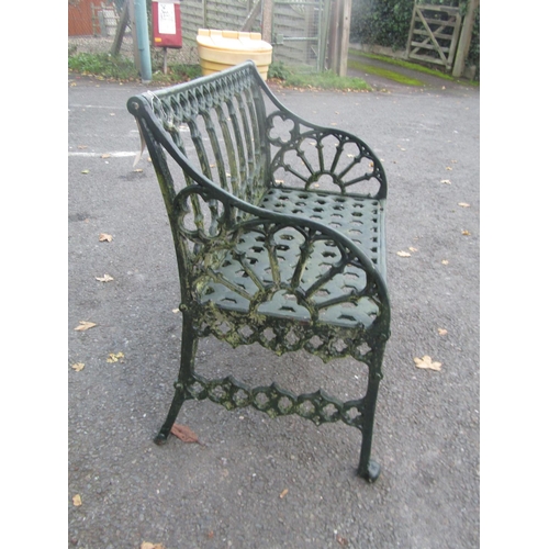 2059 - A green painted heavy gauge cast alloy two seat garden bench with Gothic tracery detail, 87cm wide
