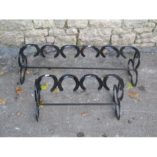 2089 - Two novelty boot racks constructed from horseshoes, the largest 88cm long x 28cm high