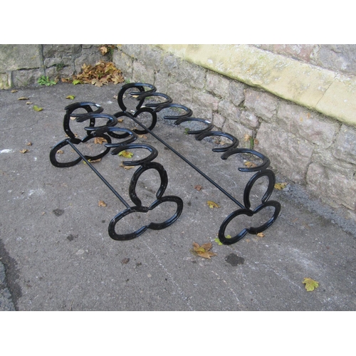 2089 - Two novelty boot racks constructed from horseshoes, the largest 88cm long x 28cm high