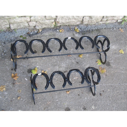 2089 - Two novelty boot racks constructed from horseshoes, the largest 88cm long x 28cm high