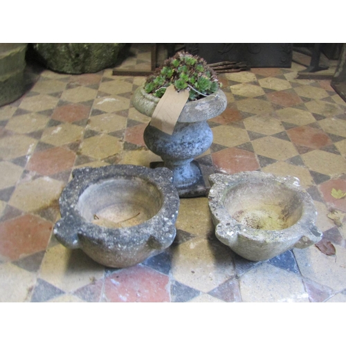 2093 - Small weathered marble urn with square cut base, 31cm high (af) together with two carved marble mort... 