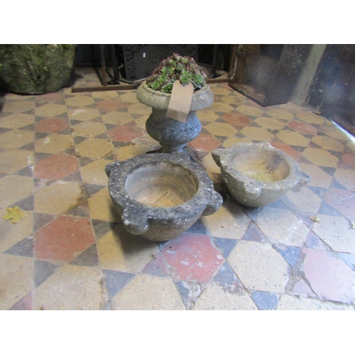 2093 - Small weathered marble urn with square cut base, 31cm high (af) together with two carved marble mort... 