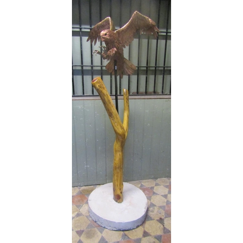 2096 - A life sized representation of a Peregrine Falcon in mahogany, overlaid with copper, the basic shape... 