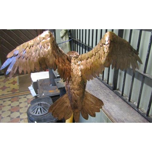 2096 - A life sized representation of a Peregrine Falcon in mahogany, overlaid with copper, the basic shape... 