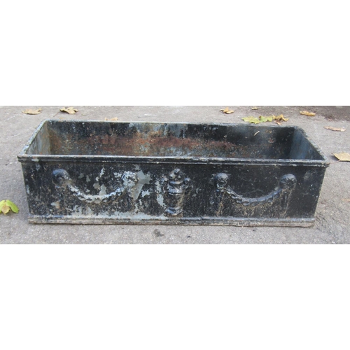 2098 - A vintage weathered rectangular cast iron planter with classical raised relief swag and urn detail, ... 