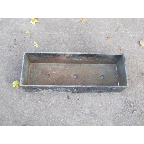 2098 - A vintage weathered rectangular cast iron planter with classical raised relief swag and urn detail, ... 