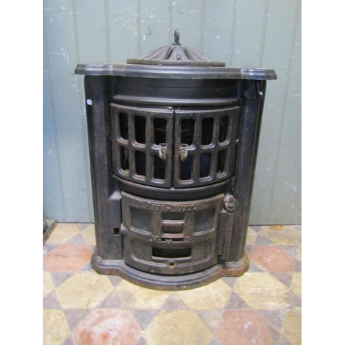 2100 - An Esse no2 cast iron bow fronted stove with pierced dome cap, (af for re-glazing) approx 50cm wide ... 