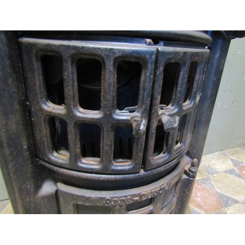 2100 - An Esse no2 cast iron bow fronted stove with pierced dome cap, (af for re-glazing) approx 50cm wide ... 