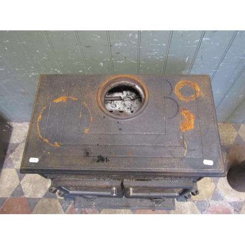 2102 - An Esse cast iron wood burner enclosed by a pair of arched panelled doors, flanked by geometric pane... 