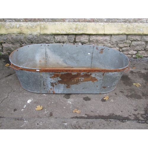 2116 - A vintage galvanised oval tub/bath with iron fittings, 120cm long x 55cm wide x 30cm deep