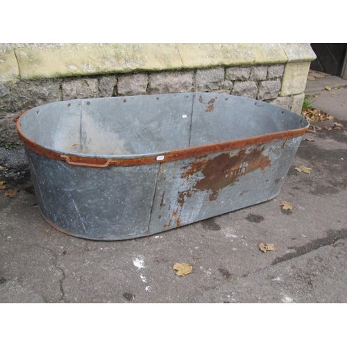 2116 - A vintage galvanised oval tub/bath with iron fittings, 120cm long x 55cm wide x 30cm deep