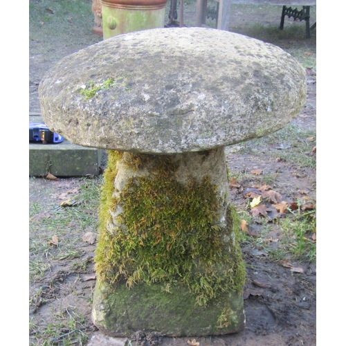 2118 - A traditional weathered squat natural stone staddlestone and domed cap, 60cm high approx