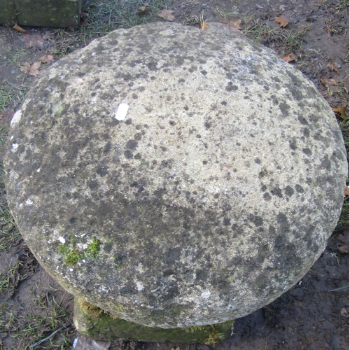 2118 - A traditional weathered squat natural stone staddlestone and domed cap, 60cm high approx