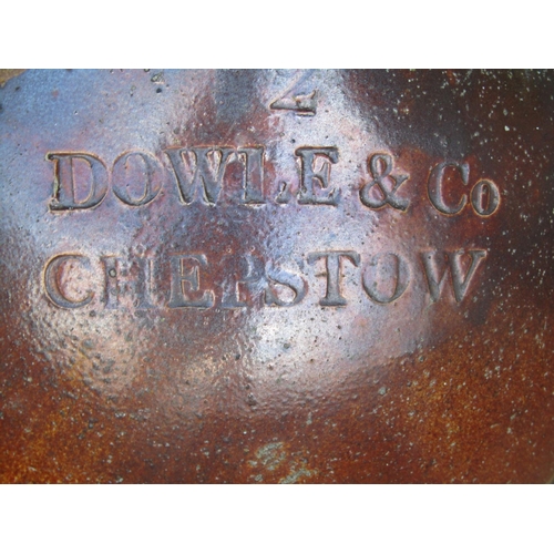 2119 - Salt glazed stoneware flagon stamped Dowle & co Chepstow (af) together with a weathered squat circul... 