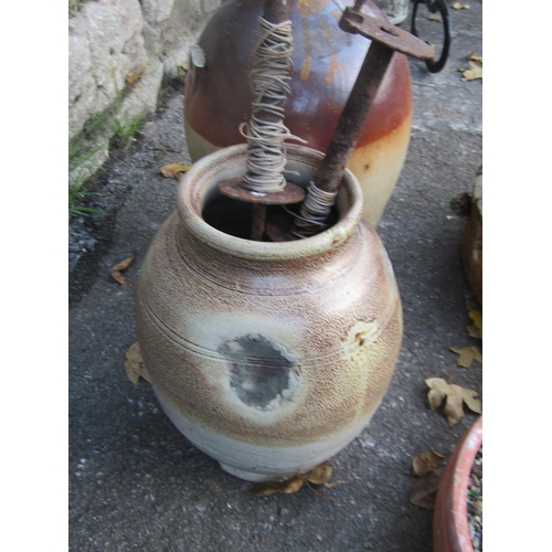 2119 - Salt glazed stoneware flagon stamped Dowle & co Chepstow (af) together with a weathered squat circul... 