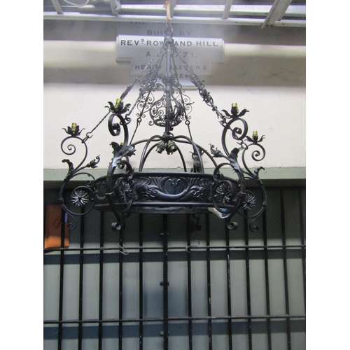 2122 - A good quality ironwork hanging ceiling light with decorative open scrollwork, flower head, leaf and... 