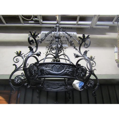 2122 - A good quality ironwork hanging ceiling light with decorative open scrollwork, flower head, leaf and... 