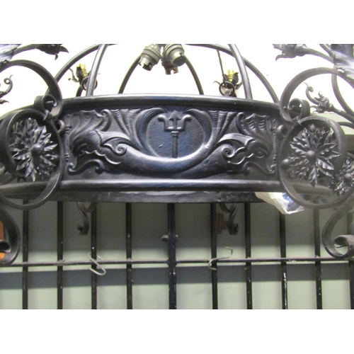 2122 - A good quality ironwork hanging ceiling light with decorative open scrollwork, flower head, leaf and... 